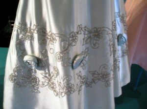Embroidery detail on 1950s silk dress hem