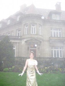 Baroness Elsa Schraeder Sound of Music dress Gold lame party dress in front of castle
