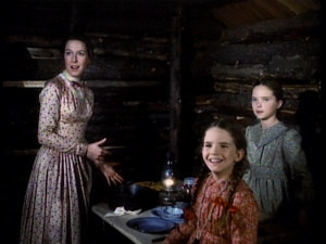 The Ingalls Ladies stare at Mr. Edwards who arrives covered in ice and nearly frozen.